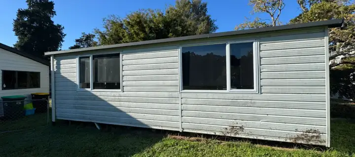 A building with bright white cladding after an exterior wash