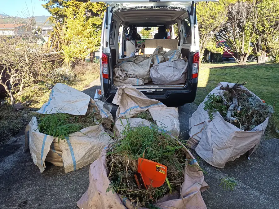 The van loaded with bags of green waste after a garden clean-up