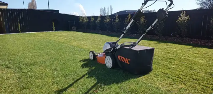 A push mower on a freshly striped lawn in Nelson Tasman