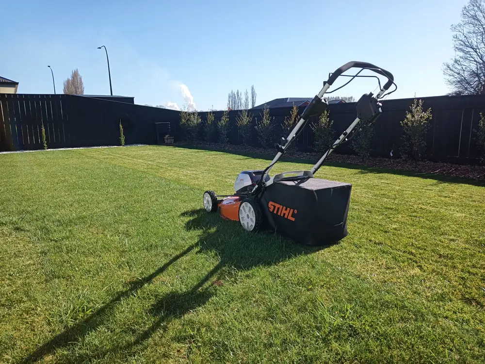 A push mower on a freshly striped lawn in Nelson Tasman